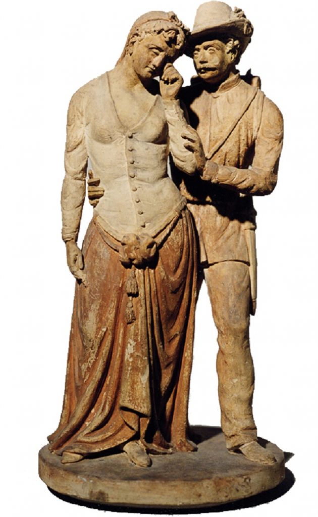 Statue of two figures embracing.